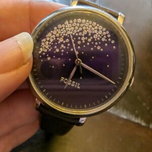 Fossil watch purple face with crystals and purple leather band.